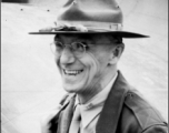 Joseph Stilwell smiles in front of an airplane in the CBI during WWII.