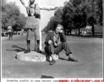 Garrett Cope accompanies a traffic policeman in New Delhi on Christmas Day, 1943.  Photo from Garrett Cope.