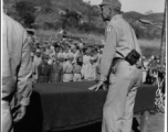 Major General H. C. Davidson, Commander of the 10th Air Force in India, addresses Chinese troops somewhere in Burma. January 28, 1945.