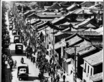 Chinese crowds eagerly welcome the first US land convoy of supplies arrives in Yunnan province after completion of the Burma/Ledo/Stilwell road.  In the CBI.  By U. S. Army Signal Corps.