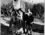 Bill Boselay stands next to a Ming Dynasty statue in the Palace Garden in Nanjing, 1945.  Photo from Bill Boselay.