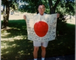 George Pollock shows off trophy captured Japanese Good-Luck Flag  (寄せ書き日の丸) collected on the battleground in the CBI during WWII.