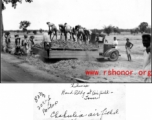 Workers dumping gravel to build road at Chabua airfield during WWII.  Photo from Stevie Little.