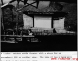 Lone GI has a long time to wait for the show to start at this typical outdoor theater in the CBI during WWII.