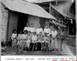 A Burmese family outside their home at Namti, Burma, 1944.