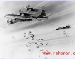 B-29 bombers in flight, dropping bombs. In the CBI during WWII.