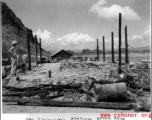 Gas straining station after Japanese air raid. Karst hills in the background hit that this is likely a US base in Guangxi province, China, either at Liuzhou or Guilin.