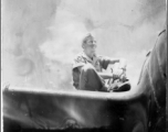 A GI sits on the wing of an airplane in the CBI during WWII. "Rob Kelt"