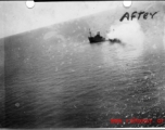 A Japanese boat sinking off the China shore after attack of American war planes during WWII.