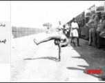 A contortionist puts on a display for GIs at a rest stop on the train ride to Ranikhet Rest Camp.  In the CBI during WWII.