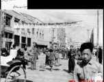 Busy street in Kunming during WWII, with GI taking it all in.  Photo from R. Hermann.