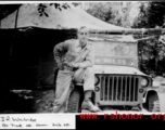 2nd Lt. J. R. Walridge leaning on jeep in the CBI, during WWII.