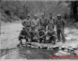 A group of American GIs during WWII near a river, likely in SW China, or Burma.