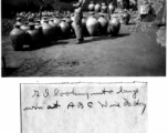 GI looks into large jug at ABC Wine Factory, near Kunming, China, March 1945.