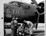 Chinese crewmen of the Chinese and American Replacement Training Unit get a last minute briefing from an American officer prior to take off on another mission. Karachi, India. Standing before the B-25 "B. T. O."  Image courtesy of Tony Strotman.