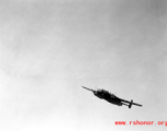 B-25 Mitchell bomber in flight in the CBI, in the area of southern China, Indochina, or Burma.