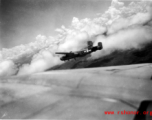 B-25 Mitchell bomber #439 in flight in the CBI, in the area of southern China, Indochina, or Burma.