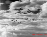 B-25 Mitchell bombers in flight in the CBI near an American air base, in the area of southern China, Indochina, or Burma. During WWII.