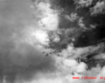 Four B-25 Mitchell bombers in flight in the CBI, in the area of southern China, Indochina, or Burma.