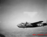 B-25 Mitchell bomber in flight in the CBI, in the area of southern China, Indochina, or Burma. During WWII.