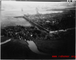 B-25 Mitchell bombers do battle with Japanese ground forces, flying over Tengchung (Tengchong), near the China-Burma border in far SW China.