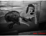 Nose art on a Consolidated B-24 bomber, of a buxom woman on the telephone. During WWII in China.