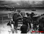 Chinese workers crush limestone for gravel and other construction needs at an American air base, Luliang.