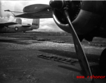 A B-25, tail number #B31205, with bombs laid out ready for loading, at the base. WWII in Yunnan province, China.