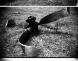 A crash at the American air base in WWII in Luliang, Yunnan province, China, showing the broken aircraft propeller and the gouge across the grass where the aircraft slid.