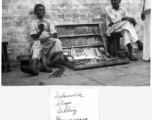 Sidewalk shop in Calcutta, India, during WWII.