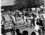 Busy market area.  Scenes in India witnessed by American GIs during WWII. For many Americans of that era, with their limited experience traveling, the everyday sights and sounds overseas were new, intriguing, and photo worthy.