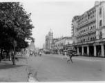 Street in large Indian city.  Scenes in India witnessed by American GIs during WWII. For many Americans of that era, with their limited experience traveling, the everyday sights and sounds overseas were new, intriguing, and photo worthy.