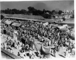 A busy market.  Scenes in India witnessed by American GIs during WWII. For many Americans of that era, with their limited experience traveling, the everyday sights and sounds overseas were new, intriguing, and photo worthy.