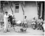 Local Indian photographer at work.  Scenes in India witnessed by American GIs during WWII. For many Americans of that era, with their limited experience traveling, the everyday sights and sounds overseas were new, intriguing, and photo worthy.