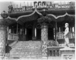 GI visiting ornate temple.  Scenes in India witnessed by American GIs during WWII. For many Americans of that era, with their limited experience traveling, the everyday sights and sounds overseas were new, intriguing, and photo worthy.