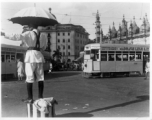 Traffic policeman directs traffic as trams go by.  Scenes in India witnessed by American GIs during WWII. For many Americans of that era, with their limited experience traveling, the everyday sights and sounds overseas were new, intriguing, and photo worthy.