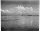 Boats with sails underway in India.  Scenes in India witnessed by American GIs during WWII. For many Americans of that era, with their limited experience traveling, the everyday sights and sounds overseas were new, intriguing, and photo worthy.