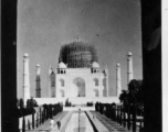 Taj Mahal under repair.  Scenes in India witnessed by American GIs during WWII. For many Americans of that era, with their limited experience traveling, the everyday sights and sounds overseas were new, intriguing, and photo worthy.