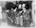 A young boy in India is the pride of his family during WWII.  Scenes in India witnessed by American GIs during WWII. For many Americans of that era, with their limited experience traveling, the everyday sights and sounds overseas were new, intriguing, and photo worthy.